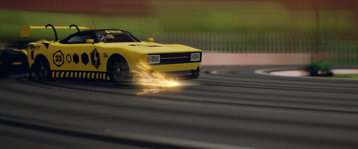 A yellow slot car on the limit, sparks flying from its guide
