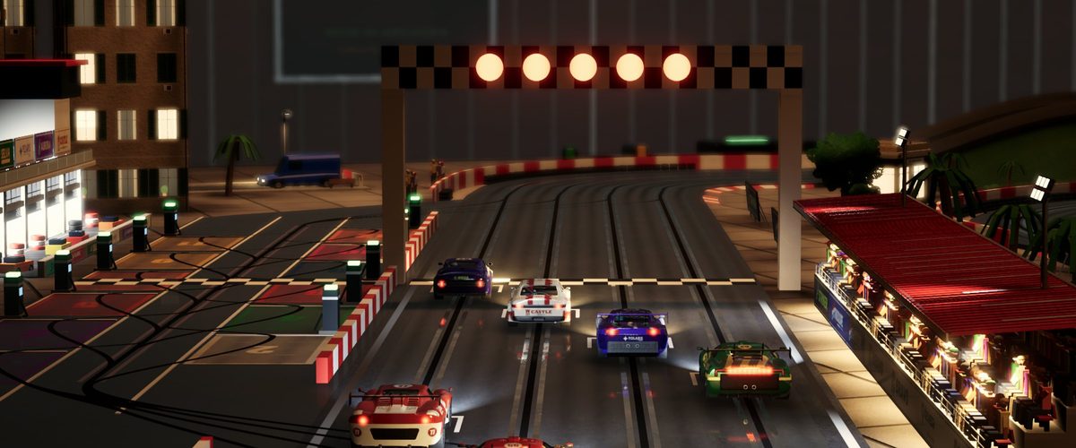 A full grid of slot cars waiting under the start lights